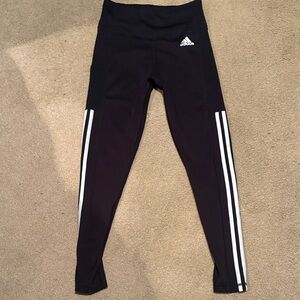 Used once Adidas size small women’s Black and White Striped Leggings with pocket